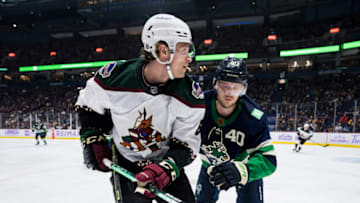Dec 3, 2022; Vancouver, British Columbia, CAN; Vancouver Canucks forward Elias Pettersson (40) battles with Arizona Coyotes defenseman Jakob Chychrun (6) in the second period at Rogers Arena. Mandatory Credit: Bob Frid-USA TODAY Sports