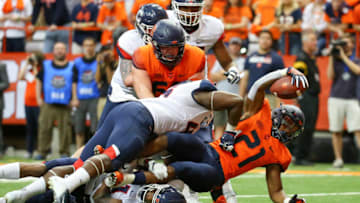 SYRACUSE, NY - SEPTEMBER 22: Moe Neal #21 of the Syracuse Orange reaches for the end zone on a run but would fall short against the Connecticut Huskies during the third quarter at the Carrier Dome on September 22, 2018 in Syracuse, New York. Syracuse defeated Connecticut 51-21. (Photo by Rich Barnes/Getty Images)