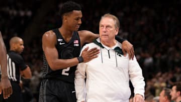 Dec 21, 2021; Detroit, Michigan, USA; Michigan State Spartans guard Tyson Walker (2) tries to calm down head coach Tom Izzo after getting a technical foul during the second half against the Oakland Golden Grizzlies at Little Caesars Arena. Mandatory Credit: Raj Mehta-USA TODAY Sports
