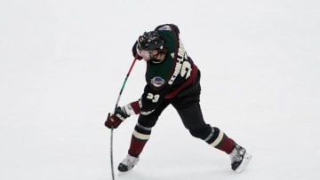 Apr 19, 2021; Glendale, Arizona, USA; Arizona Coyotes defenseman Oliver Ekman-Larsson (23) shoots against the Minnesota Wild during the first period at Gila River Arena. Mandatory Credit: Joe Camporeale-USA TODAY Sports