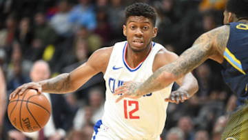 DENVER, CO - FEBRUARY 27: Tyrone Wallace #12 of the LA Clippers drives to the basket during the game against the Denver Nuggets at Pepsi Center on February 27, 2018 in Denver, Colorado. (Photo by Justin Tafoya/Getty Images)