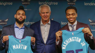 Jun 21, 2019; Charlotte, NC, USA; Charlotte Hornets president of basketball operations Mitch Kupchak, center, introduces 2019 NBA draft picks PJ Washington, right, and Cody Martin during a press conference at Spectrum Center. Mandatory Credit: Nell Redmond-USA TODAY Sports