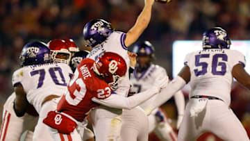 NORMAN, OK - NOVEMBER 23: Linebacker DaShaun White #23 of the Oklahoma Sooners hits quarterback Max Duggan #15 of the TCU Horned Frogs as he releases an errant pass in the second quarter on November 23, 2019 at Gaylord Family Oklahoma Memorial Stadium in Norman, Oklahoma. OU held on to win 28-24. (Photo by Brian Bahr/Getty Images)