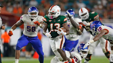 MIAMI GARDENS, FL - SEPTEMBER 8: DeeJay Dallas #13 of the Miami Hurricanes runs with the ball against the Savannah State Tigers on September 8, 2018 at Hard Rock Stadium in Miami Gardens, Florida. Miami defeated Savannah State 77-0. (Photo by Joel Auerbach/Getty Images)