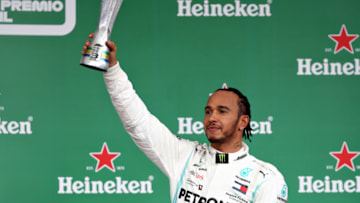 SAO PAULO, BRAZIL - NOVEMBER 17: Third placed Lewis Hamilton of Great Britain and Mercedes GP celebrates on the podium during the F1 Grand Prix of Brazil at Autodromo Jose Carlos Pace on November 17, 2019 in Sao Paulo, Brazil. (Photo by Mark Thompson/Getty Images)