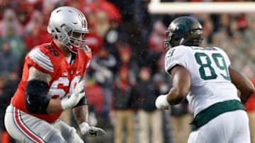 Nov 21, 2015; Columbus, OH, USA; Ohio State Buckeyes offensive lineman Taylor Decker (68) blocks against the Michigan State Spartans at Ohio Stadium. Mandatory Credit: Geoff Burke-USA TODAY Sports