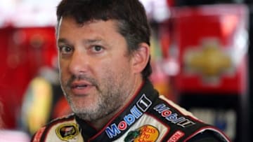 Jul 25, 2014; Indianapolis, IN, USA; NASCAR Sprint Cup Series driver Tony Stewart stands in his garage during practice for the Crown Royal Brickyard 400 at Indianapolis Motor Speedway. Mandatory Credit: Brian Spurlock-USA TODAY Sports