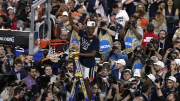 MINNEAPOLIS, MINNESOTA - APRIL 08: Mamadi Diakite #25 of the Virginia Cavaliers cuts down the net after his teams 85-77 win over the Texas Tech Red Raiders in the 2019 NCAA men's Final Four National Championship game at U.S. Bank Stadium on April 08, 2019 in Minneapolis, Minnesota. (Photo by Hannah Foslien/Getty Images)