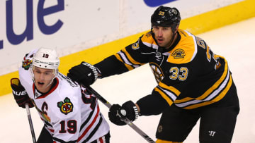 BOSTON - DECEMBER 11: The Bruins' Zdeno Chara keeps the Blackhawks' Jonathan Toews in check near the Bruins net in the 1st period as he looks for a pass. The Boston Bruins played the Chicago Blackhawks on December 11, 2014. (Photo by John Tlumacki/The Boston Globe via Getty Images)