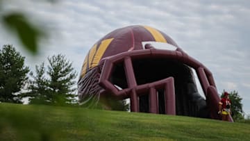 ASHBURN, VA - AUGUST 17: A general view as a fan walks through the inflatable Washington Commanders helmet during training camp at INOVA Sports Performance Center on August 17, 2022 in Ashburn, Virginia. (Photo by Scott Taetsch/Getty Images)