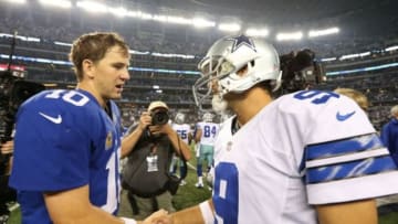 Sep 8, 2013; Arlington, TX, USA; Dallas Cowboys quarterback Tony Romo (9) shakes hands with New York Giants quarterback Eli Manning (10) after the game at AT&T Stadium. The Dallas Cowboys beat the New York Giants 36-31. Mandatory Credit: Matthew Emmons-USA TODAY Sports