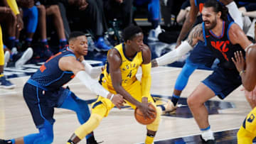 INDIANAPOLIS, IN - DECEMBER 13: Russell Westbrook #0 and Steven Adams #12 of the Oklahoma City Thunder defend against Victor Oladipo #4 of the Indiana Pacers during a game at Bankers Life Fieldhouse on December 13, 2017 in Indianapolis, Indiana. The Thunder defeated the Pacers 100-95. (Photo by Joe Robbins/Getty Images)