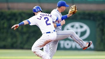 Jul 19, 2016; Chicago, IL, USA; Chicago Cubs third baseman Tommy La Stella (2) slides safely into second base while New York Mets shortstop Asdrubal Cabrera (13) attempts a tag during the first inning at Wrigley Field. Mandatory Credit: Caylor Arnold-USA TODAY Sports