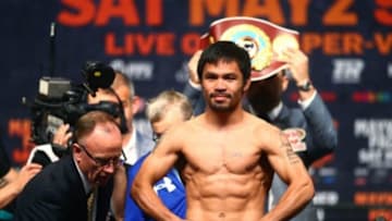 May 1, 2015; Las Vegas, NV, USA; Manny Pacquiao flexes during weigh-ins for the upcoming boxing fight against Floyd Mayweather (not pictured) at MGM Grand Garden Arena. Mandatory Credit: Mark J. Rebilas-USA TODAY Sports