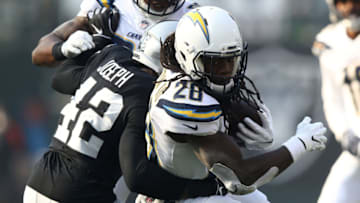 OAKLAND, CA - NOVEMBER 11: Melvin Gordon #28 of the Los Angeles Chargers rushes with the ball against the Oakland Raiders during their NFL game at Oakland-Alameda County Coliseum on November 11, 2018 in Oakland, California. (Photo by Ezra Shaw/Getty Images)