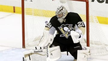Oct 30, 2014; Pittsburgh, PA, USA; Pittsburgh Penguins goalie Marc-Andre Fleury (29) makes a pad save against the Los Angeles Kings during the second period at the CONSOL Energy Center. Mandatory Credit: Charles LeClaire-USA TODAY Sports