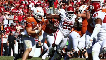 Oct 12, 2019; Dallas, TX, USA; Texas Longhorns quarterback Sam Ehlinger (11) runs for a fourth quarter touchdown against the Oklahoma Sooners at Cotton Bowl. Mandatory Credit: Matthew Emmons-USA TODAY Sports