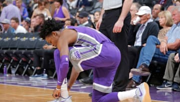 SACRAMENTO, CA - FEBRUARY 24: De'Aaron Fox #5 of the Sacramento Kings ties his sneakers during the game against the Los Angeles Lakers on February 24, 2018 at Golden 1 Center in Sacramento, California. NOTE TO USER: User expressly acknowledges and agrees that, by downloading and or using this photograph, User is consenting to the terms and conditions of the Getty Images Agreement. Mandatory Copyright Notice: Copyright 2018 NBAE (Photo by Rocky Widner/NBAE via Getty Images)