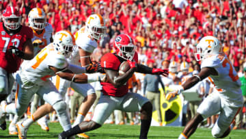 ATHENS, GA - OCTOBER 1: Sony Michel #1 of the Georgia Bulldogs runs for a first quarter touchdown against Todd Kelly, Jr. #24 and Micah Abernathy #22 of the Tennessee Volunteers at Sanford Stadium on October 1, 2016 in Athens, Georgia. (Photo by Scott Cunningham/Getty Images)