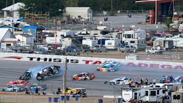 TALLADEGA, ALABAMA - OCTOBER 14: Brendan Gaughan, driver of the #62 BeardOilDistributing/SouthPointHotel&Casino Chevrolet, flips upside down during the Monster Energy NASCAR Cup Series 1000Bulbs.com 500 at Talladega Superspeedway on October 14, 2019 in Talladega, Alabama. (Photo by Sean Gardner/Getty Images)
