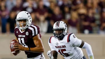 Kellen Mond #11 of the Texas A&M Aggies runs from Aaron Sterling #15 of the South Carolina Gamecocks. (Photo by Bob Levey/Getty Images)