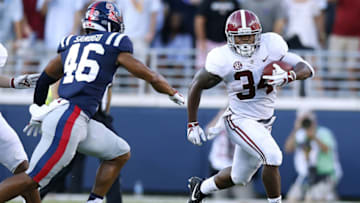 OXFORD, MS - SEPTEMBER 15: Damien Harris #34 of the Alabama Crimson Tide runs with the ball as Mohamed Sanogo #46 of the Mississippi Rebels defends during the first half at Vaught-Hemingway Stadium on September 15, 2018 in Oxford, Mississippi. (Photo by Jonathan Bachman/Getty Images)
