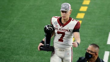 OU quarterback Spencer Rattler (7) walks off the field after beating Iowa State in the Big 12 title game last December.rattler