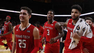 AMES, IA - MARCH 9: Texas Tech Red Raiders Tariq Owens #11, Davide Moretti #25, Deshawn Corprew #3, Kyler Edwards #0 run off the court after defeating the Iowa State Cyclones 80-73 in the second half of play at Hilton Coliseum on March 9, 2019 in Ames, Iowa. The Texas Tech Red Raiders won 80-73 over the Iowa State Cyclones. (Photo by David Purdy/Getty Images)