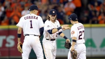 Oct 11, 2015; Houston, TX, USA; Houston Astros left fielder Colby Rasmus (center), second baseman Jose Altuve (27), and shortstop Carlos Correa (1) celebrate after defeating the Kansas City Royals in game three of the ALDS at Minute Maid Park. Astros won 4-2. Mandatory Credit: Troy Taormina-USA TODAY Sports