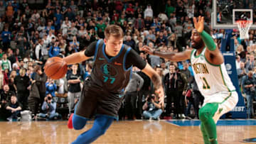 DALLAS, TX - NOVEMBER 24: Luka Doncic #77 of the Dallas Mavericks handles the ball against the Boston Celtics on November 24, 2018 at the American Airlines Center in Dallas, Texas. NOTE TO USER: User expressly acknowledges and agrees that, by downloading and or using this photograph, User is consenting to the terms and conditions of the Getty Images License Agreement. Mandatory Copyright Notice: Copyright 2018 NBAE (Photo by Glenn James/NBAE via Getty Images)