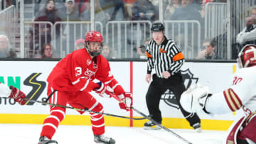 BOSTON, MA - FEBRUARY 03: Boston University Terriers forward Trevor Zegras (13) takes a shot on goal during the game between Boston College and Boston University on February 03, 2020, at TD Garden in Boston, Massachusetts. (Photo by Mark Box/Icon Sportswire via Getty Images)