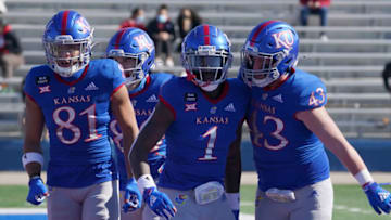 Oct 31, 2020; Lawrence, Kansas, USA; Kansas Jayhawks running back Pooka Williams Jr. (1) celebrates with Kansas Jayhawks linebacker Jay Dineen (43) after scoring during the game against the Iowa State Cyclones at David Booth Kansas Memorial Stadium. Mandatory Credit: Denny Medley-USA TODAY Sports