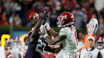 Auburn football Nov 27, 2021; Auburn, Alabama, USA; Auburn Tigers cornerback Roger McCreary (23) breaks up a pass intended for Alabama Crimson Tide wide receiver John Metchie III (8) in the fourth quarter at Jordan-Hare Stadium. Mandatory Credit: John Reed-USA TODAY Sports