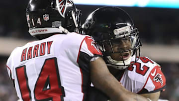 PHILADELPHIA, PA - JANUARY 13: Running back Devonta Freeman #24 of the Atlanta Falcons celebrates his touchdown with teammate wide receiver Justin Hardy #14 against the Philadelphia Eagles during the second quarter in the NFC Divisional Playoff game at Lincoln Financial Field on January 13, 2018 in Philadelphia, Pennsylvania. (Photo by Abbie Parr/Getty Images)