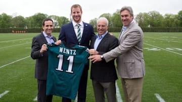 Apr 29, 2016; Philadelphia, PA, USA; From right to left Philadelphia Eagles head coach Doug Pederson and owner Jeffrey Lurie and quarterback Carson Wentz and vice president of football operations Howie Roseman pose for a photo as Wentz is introduced to the media at NovaCare Complex Auditorium. Mandatory Credit: Bill Streicher-USA TODAY Sports