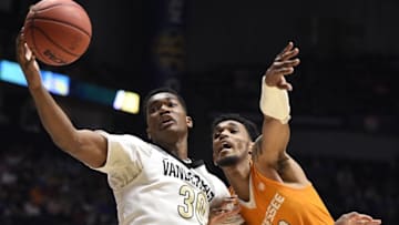Mar 10, 2016; Nashville, TN, USA; Vanderbilt center Damian Jones (30) keeps the ball from Tennessee forward Derek Reese (23) during the SEC basketball tournament at Bridgestone Arena. Mandatory Credit: Andrew Nelles/The Tennessean via USA TODAY NETWORK