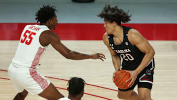 Dec 5, 2020; Houston, Texas, USA; South Carolina Gamecocks forward Alanzo Frink (20) controls the ball as Houston Cougars forward Brison Gresham (55) defends during the first half at Fertitta Center. Mandatory Credit: Troy Taormina-USA TODAY Sports