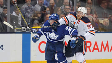 TORONTO, ON - FEBRUARY 27: Connor McDavid #97 of the Edmonton Oilers skates against Travis Dermott #23 of the Toronto Maple Leafs during an NHL game at Scotiabank Arena on February 27, 2019 in Toronto, Ontario, Canada. (Photo by Claus Andersen/Getty Images)