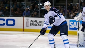 Apr 7, 2016; San Jose, CA, USA; Winnipeg Jets defenseman Jacob Trouba (8) looks to pass against the San Jose Sharks in the second period at SAP Center at San Jose. Winnipeg won 5-4. Mandatory Credit: John Hefti-USA TODAY Sports