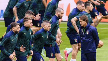 MUNICH, GERMANY - JULY 01: Italy Head Coach Roberto Mancini (R) walks in the field during An Italy training session/press conference ahead of the Euro 2020 Quarter Final match between Italy and Belgium at Fussball Arena Muenchen on July 1, 2021 in Munich, Germany. (Photo by Marcio Machado/Getty Images)