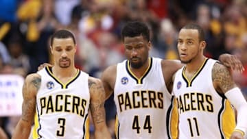 Apr 23, 2016; Indianapolis, IN, USA; Indiana Pacers guard George Hill (3) forward Solomon Hill (44) and guard Monta Ellis (11) walk back to the bench after a skirmish with the Toronto Raptors during the fourth quarter of game four of the first round of the 2016 NBA Playoffs at Bankers Life Fieldhouse. Indiana defeats Toronto 100-83. Mandatory Credit: Brian Spurlock-USA TODAY Sports