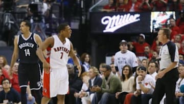 May 4, 2014; Toronto, Ontario, CAN; Toronto Raptors guard Kyle Lowry (7) questions a call by an official as Brooklyn Nets guard Shaun Livingston (14) walks away in game seven of the first round of the 2014 NBA Playoffs at the Air Canada Centre. Brooklyn defeated Toronto 104-103. Mandatory Credit: John E. Sokolowski-USA TODAY Sports