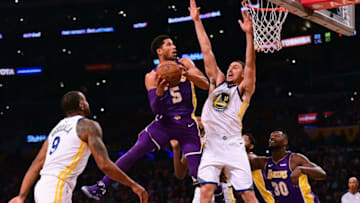 LOS ANGELES, CA - NOVEMBER 29: Josh Hart #5 of the Los Angeles Lakers attempts a shot in front of Klay Thompson #11 of the Golden State Warriors during a 127-123 Warriors win in ovetime at Staples Center on November 29, 2017 in Los Angeles, California. (Photo by Harry How/Getty Images)