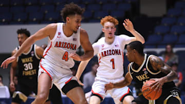 ANAHEIM, CA - DECEMBER 01: Nico Mannion #1 and Chase Jeter #4 of the Arizona Wildcats guard Torry Johnson #11 of the Wake Forest Demon Deacons in the first half of the game during the Wooden Legacy at the Anaheim Convention Center at on December 1, 2019 in Anaheim, California. (Photo by Jayne Kamin-Oncea/Getty Images)