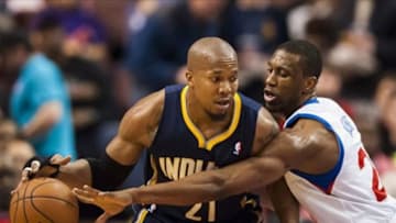Mar 14, 2014; Philadelphia, PA, USA; Philadelphia 76ers forward Thaddeus Young (21) defends the dribble of Indiana Pacers forward David West (21) during the first quarter at the Wells Fargo Center. Mandatory Credit: Howard Smith-USA TODAY Sports