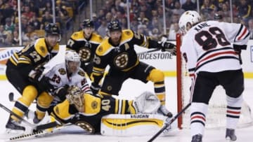 Dec 11, 2014; Boston, MA, USA; Chicago Blackhawks right wing Patrick Kane (88) takes a shot at Boston Bruins goalie Tuukka Rask (40) while right wing Kris Versteeg (23) is defended by defenseman Dougie Hamilton (27) during the second period at TD Banknorth Garden. Mandatory Credit: Greg M. Cooper-USA TODAY Sports