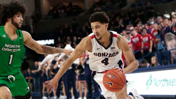 SPOKANE, WASHINGTON - NOVEMBER 12: Ryan Woolridge #4 of the Gonzaga Bulldogs drives against Marlon Stewart #1 of the North Dakota Fighting Hawks in the second half at McCarthey Athletic Center on November 12, 2019 in Spokane, Washington. Gonzaga defeats North Dakota 97-66. (Photo by William Mancebo/Getty Images)