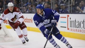 Jan 29, 2015; Toronto, Ontario, CAN; Toronto Maple Leafs forward David Clarkson (71) carries the puck past Arizona Coyotes defenseman Andrew Campbell (45) at the Air Canada Centre. Arizona defeated Toronto 3-1. Mandatory Credit: John E. Sokolowski-USA TODAY Sports