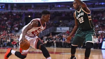 Oct 6, 2015; Chicago, IL, USA; Chicago Bulls guard Jimmy Butler (21) dribbles the ball against Milwaukee Bucks forward Khris Middleton (22) during the second quarter at United Center. Mandatory Credit: Mike DiNovo-USA TODAY Sports