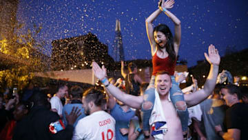 England fans celebrate as England win in the penalty shoot out as they watch the Russia 2018 World Cup round of 16 football match between Colombia and England on a big screen in London on July 3, 2018. - England beat Colombia in a dramatic penalty shootout in Moscow on Tuesday to reach the World Cup quarter-finals. (Photo by Tolga AKMEN / AFP) (Photo credit should read TOLGA AKMEN/AFP/Getty Images)